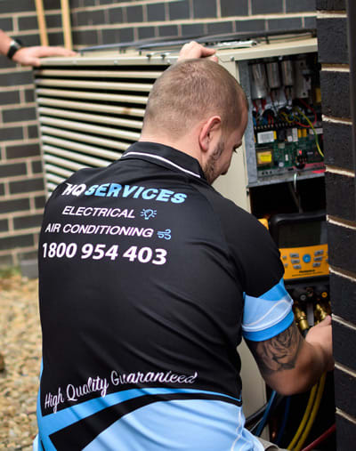 Air Conditioner Technician Servicing Unit
