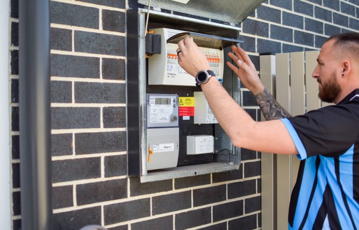 Electrian Installing Safety Switches