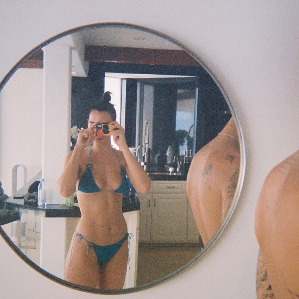 Image of Dua Lipa in the mirror wearing a blue bikini by Oseree