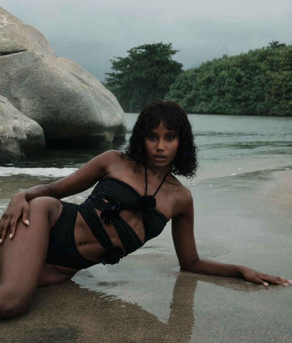 Trinitaria one-piece in black by Maygel Coronel