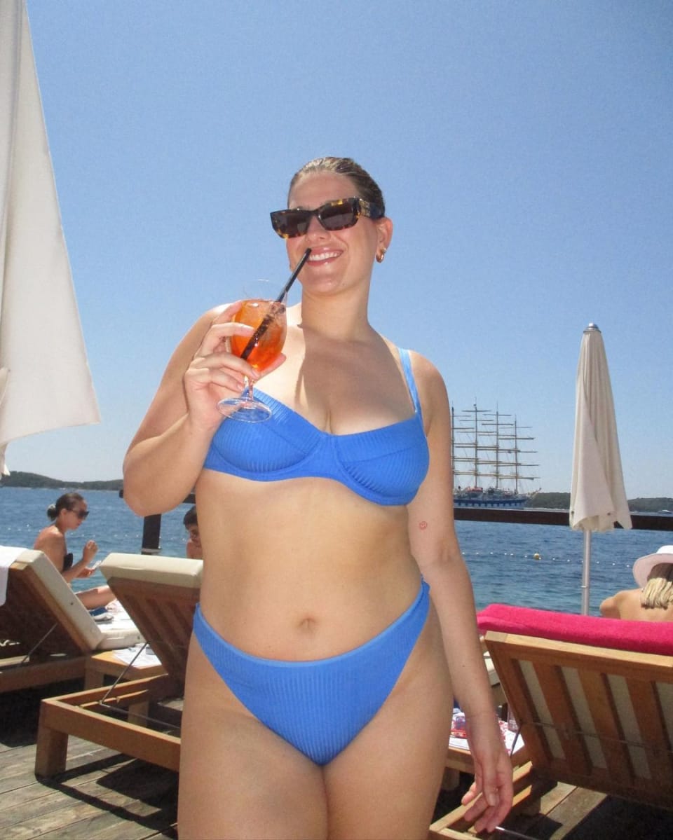 Raeann Langas wearing a sky blue bikini by Monday Swimwear