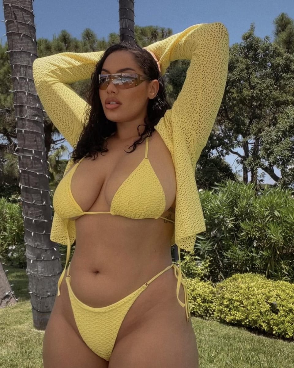 Paris wearing a yellow crochet bikini by Monday Swimwear