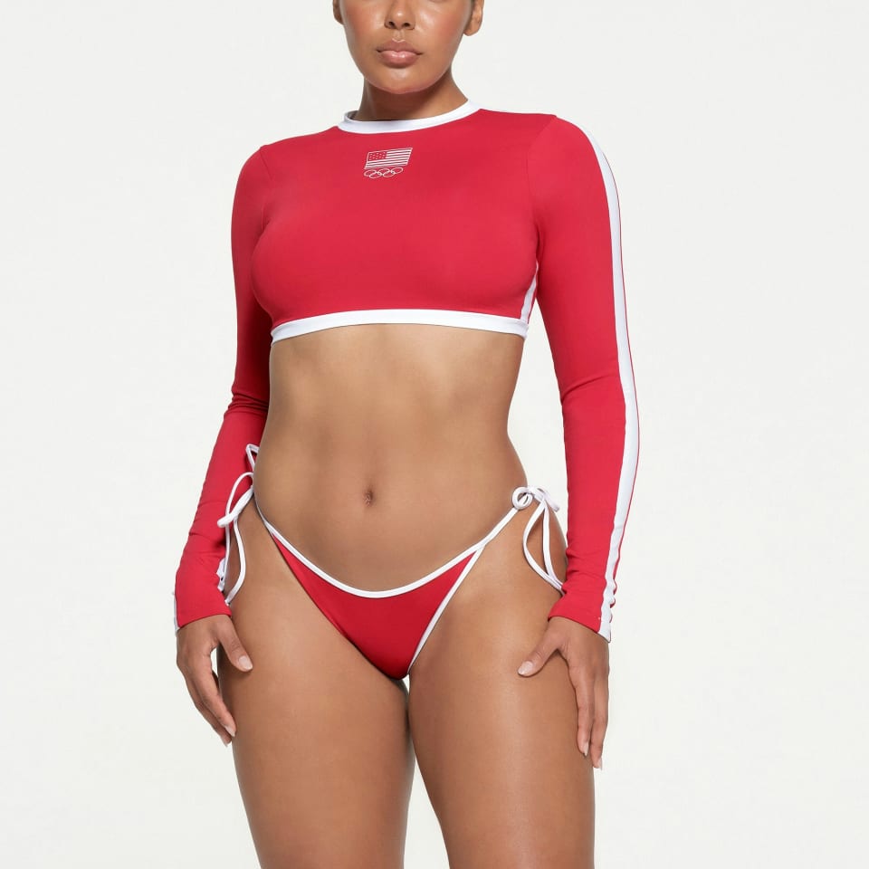 IGNATURE SWIM OLYMPIC LONG SLEEVE CROPPED T-SHIRT and SIGNATURE SWIM DIPPED TIE BOTTOM by Skims