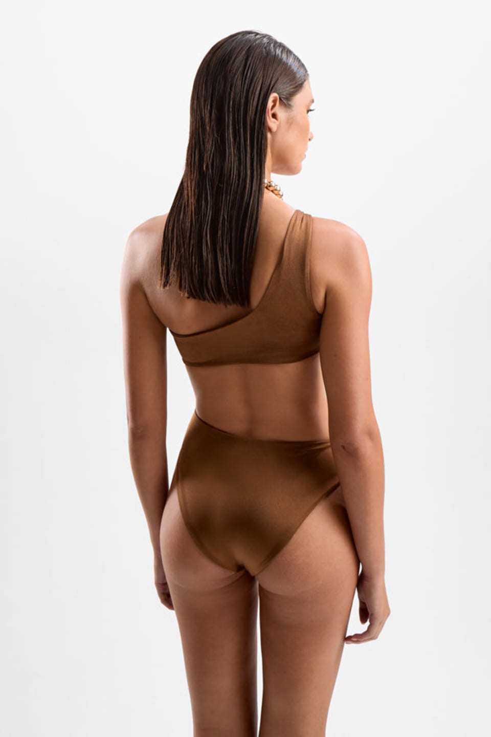 Cin Cin Orbit Swimsuit in Mocha, side view of the artful cut-outs, editorial