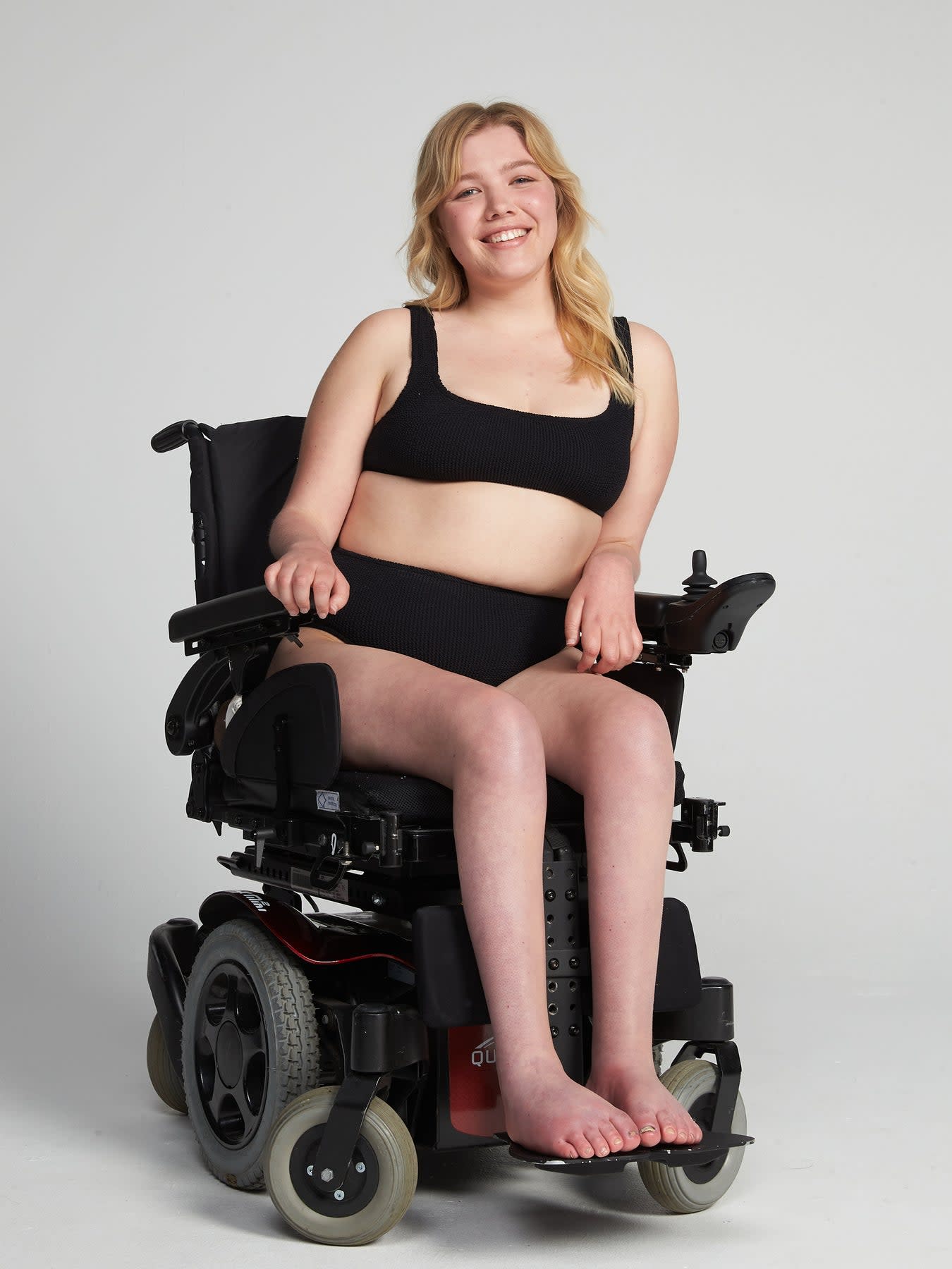 Model in wheelchair wearing black bikini by Youswim