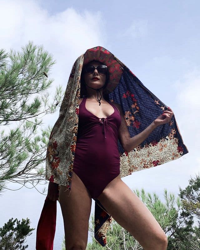 Photo of Catherine Baba wearing a swimsuit by Yasmine Eslami