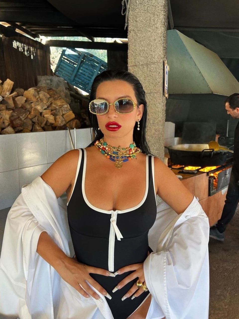 Aureta wearing a black swimsuit