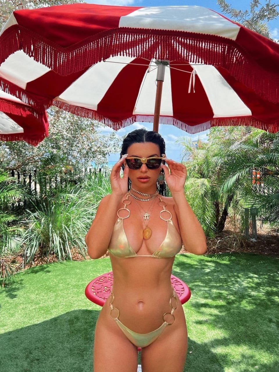 Aureta wearing a ring gold bikini