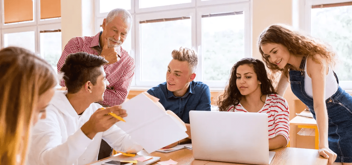 Teacher with students - preparing them for language exam