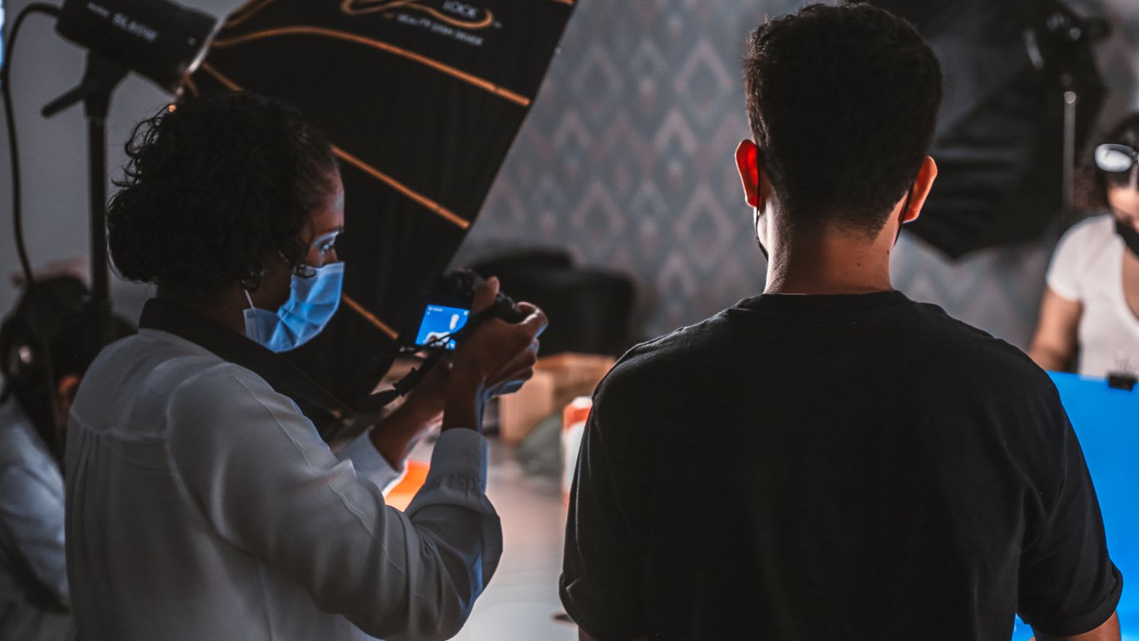 A photoshoot in progress in a professional studio