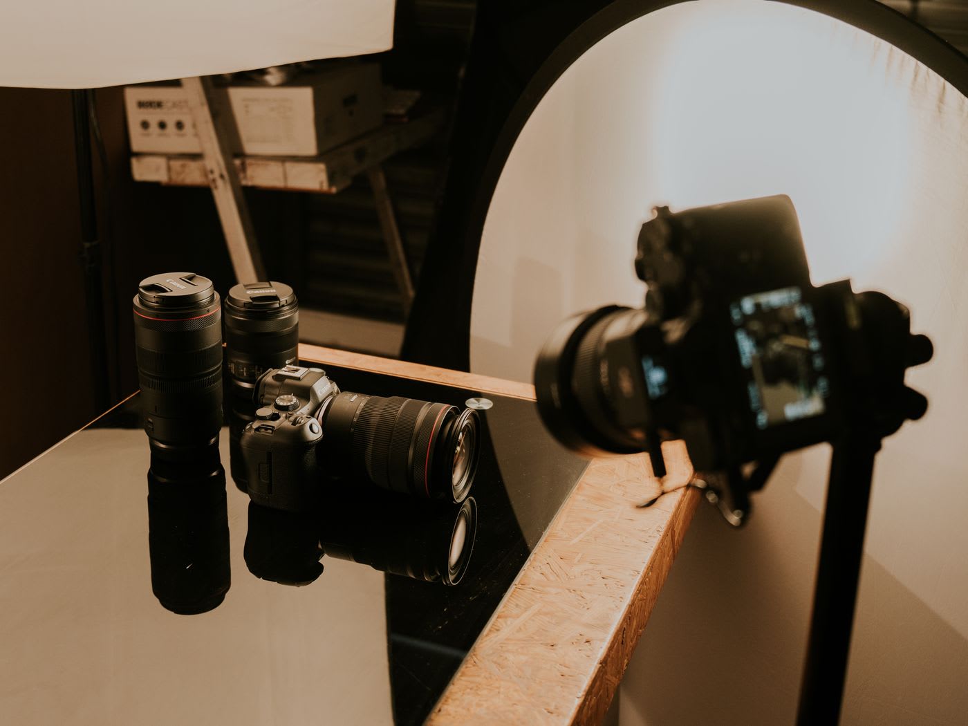 A professional camera and lens setup laid out on a table