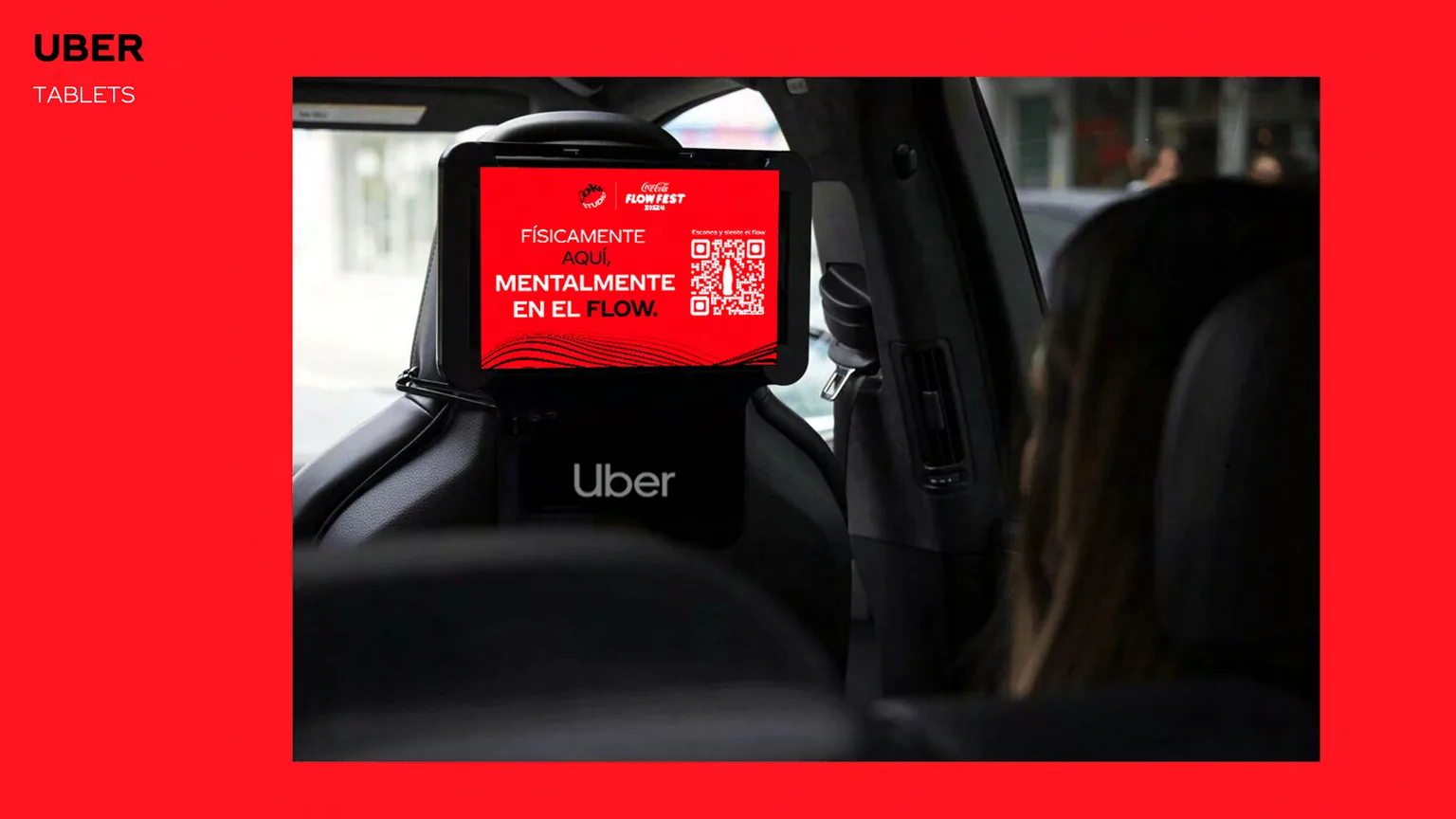 The Flow Fest in-car placement: a tablet on the back of an Uber headrest showing a red Coca-Cola Flow Fest screen with a QR code