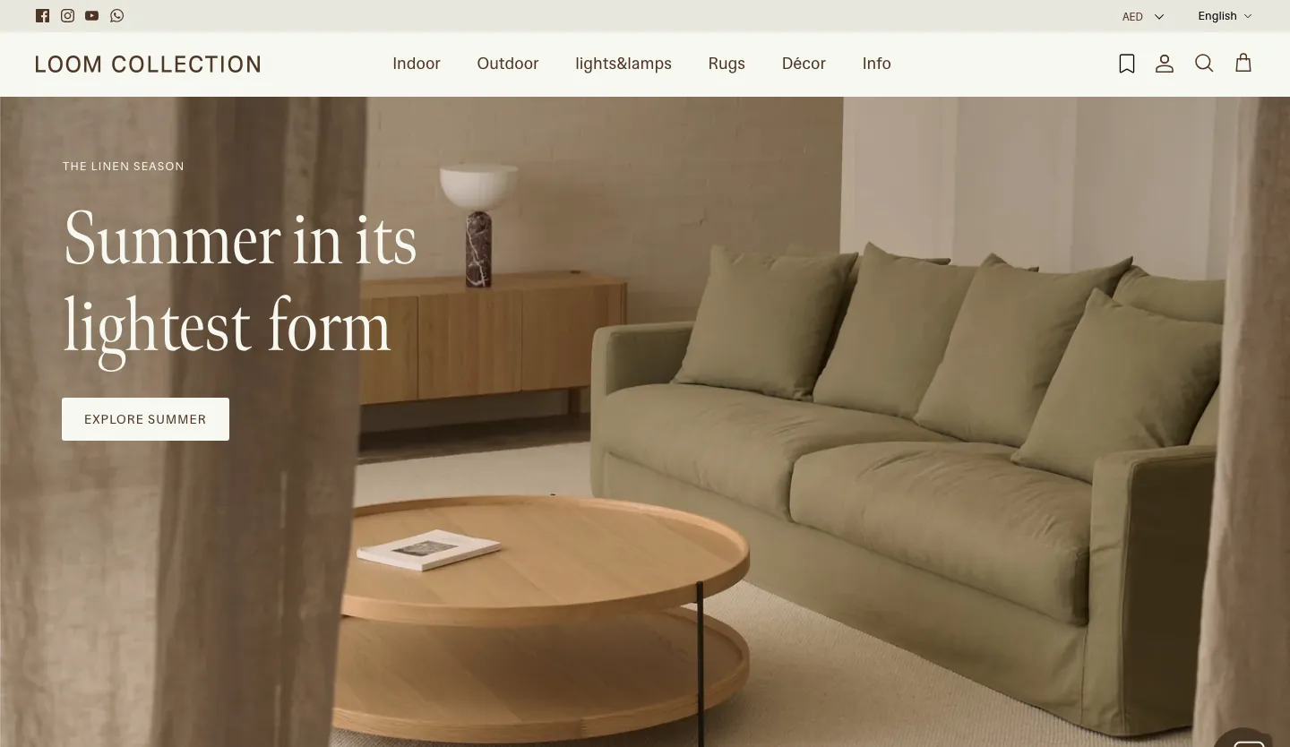 The Loom Collection home page: The Linen Season, Summer in its lightest form, over an olive sofa and a round wooden coffee table