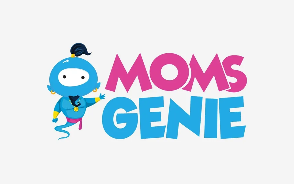 The redesigned MomsGenie logo: Wishie the blue genie beside the stacked MOMS GENIE wordmark in magenta and sky blue