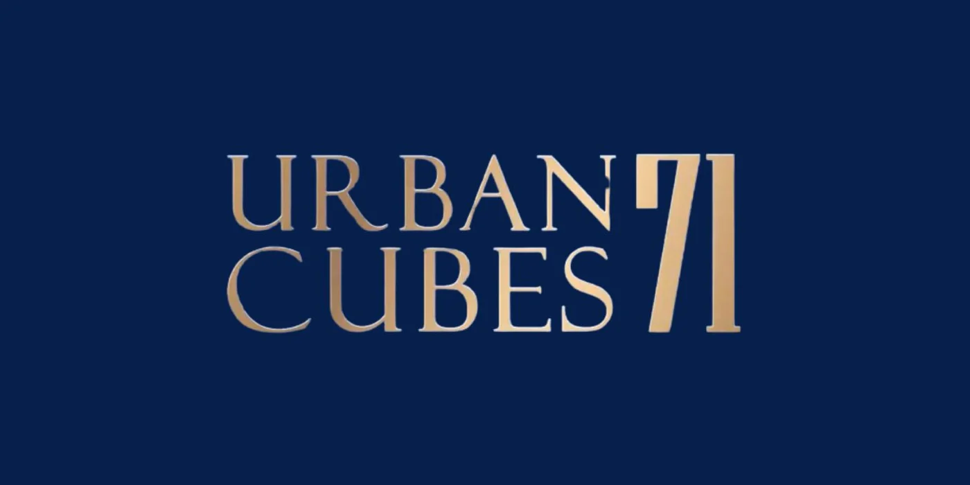 The URBAN CUBES 71 wordmark in a gold finish on navy
