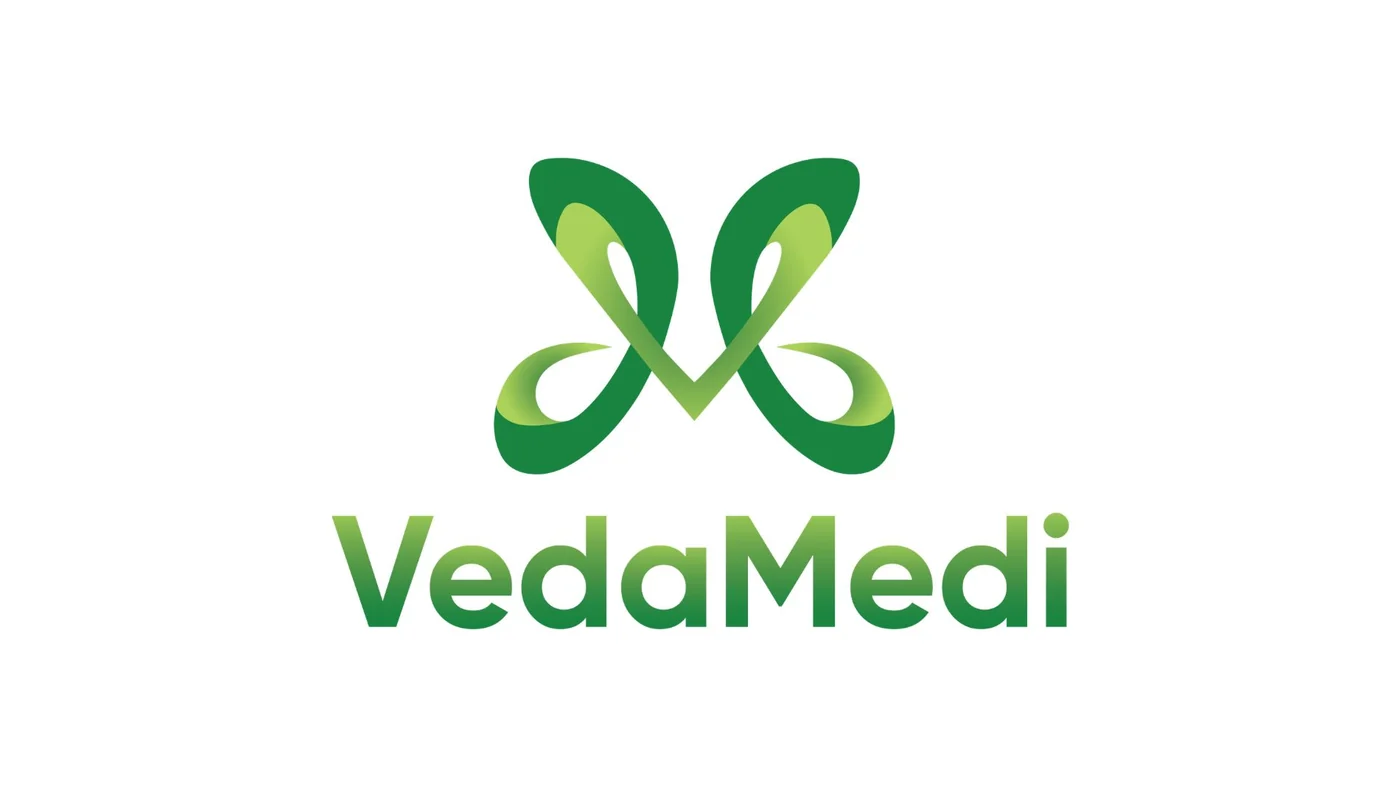 The VedaMedi logo, close: the merged V and M symbol in two greens above the VedaMedi wordmark