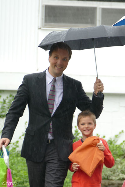family in rain