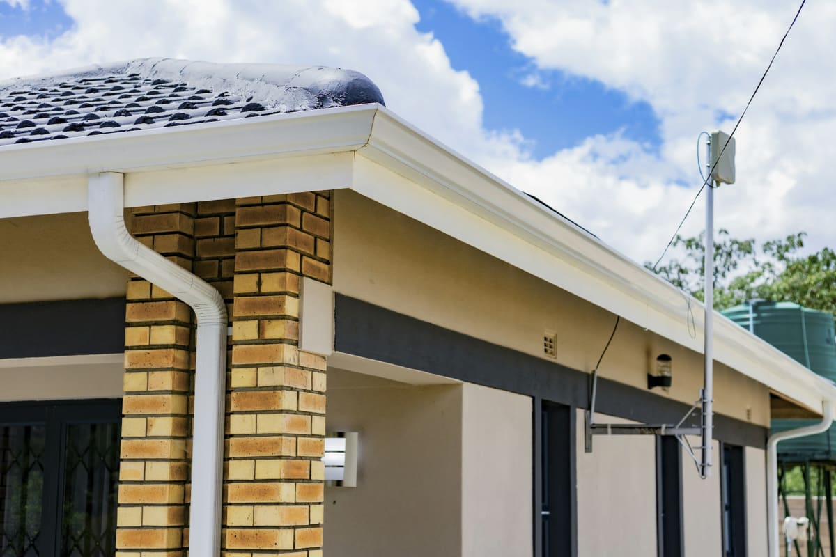White gutters and downspouts on a single-story home