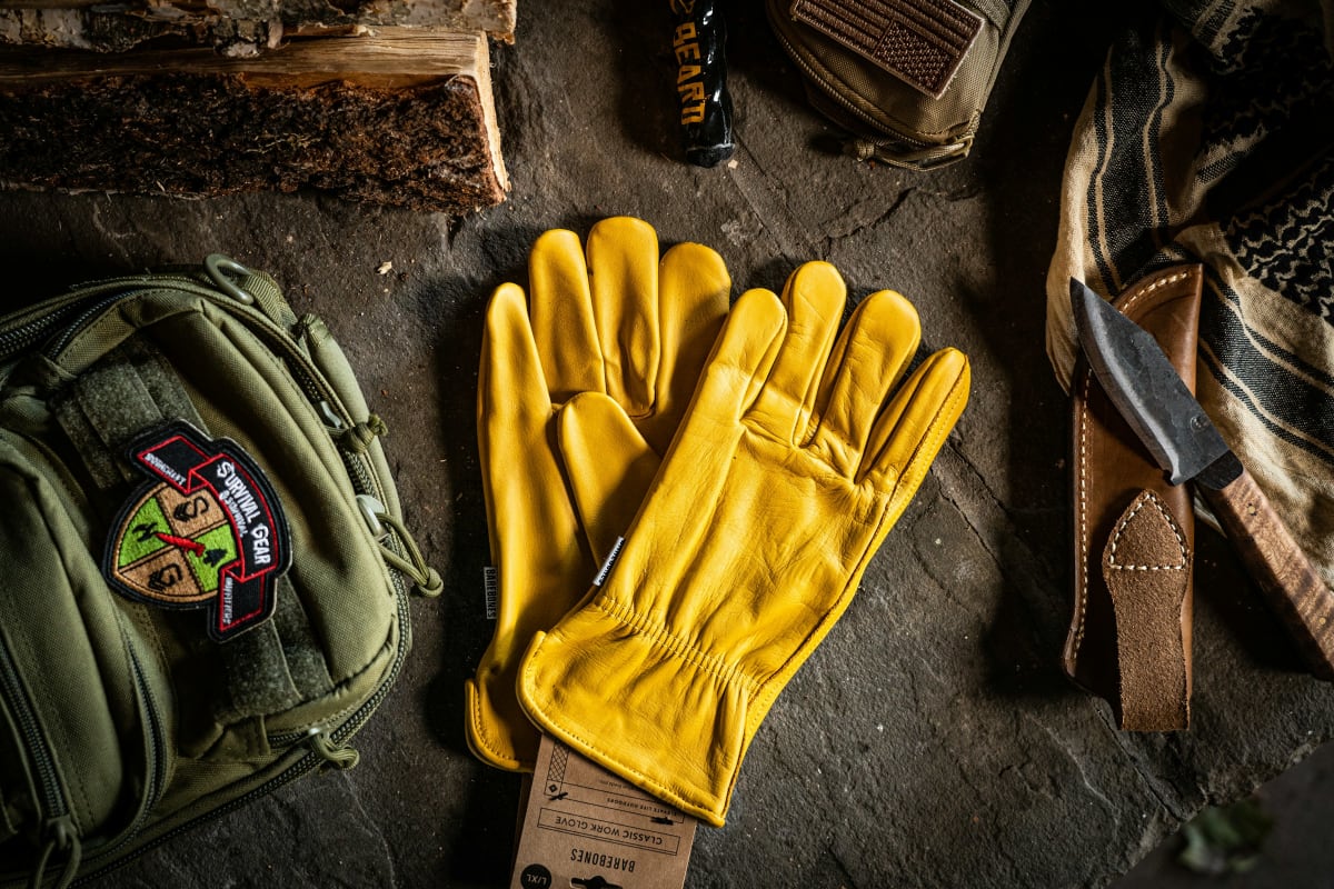 Yellow leather work gloves on a workbench