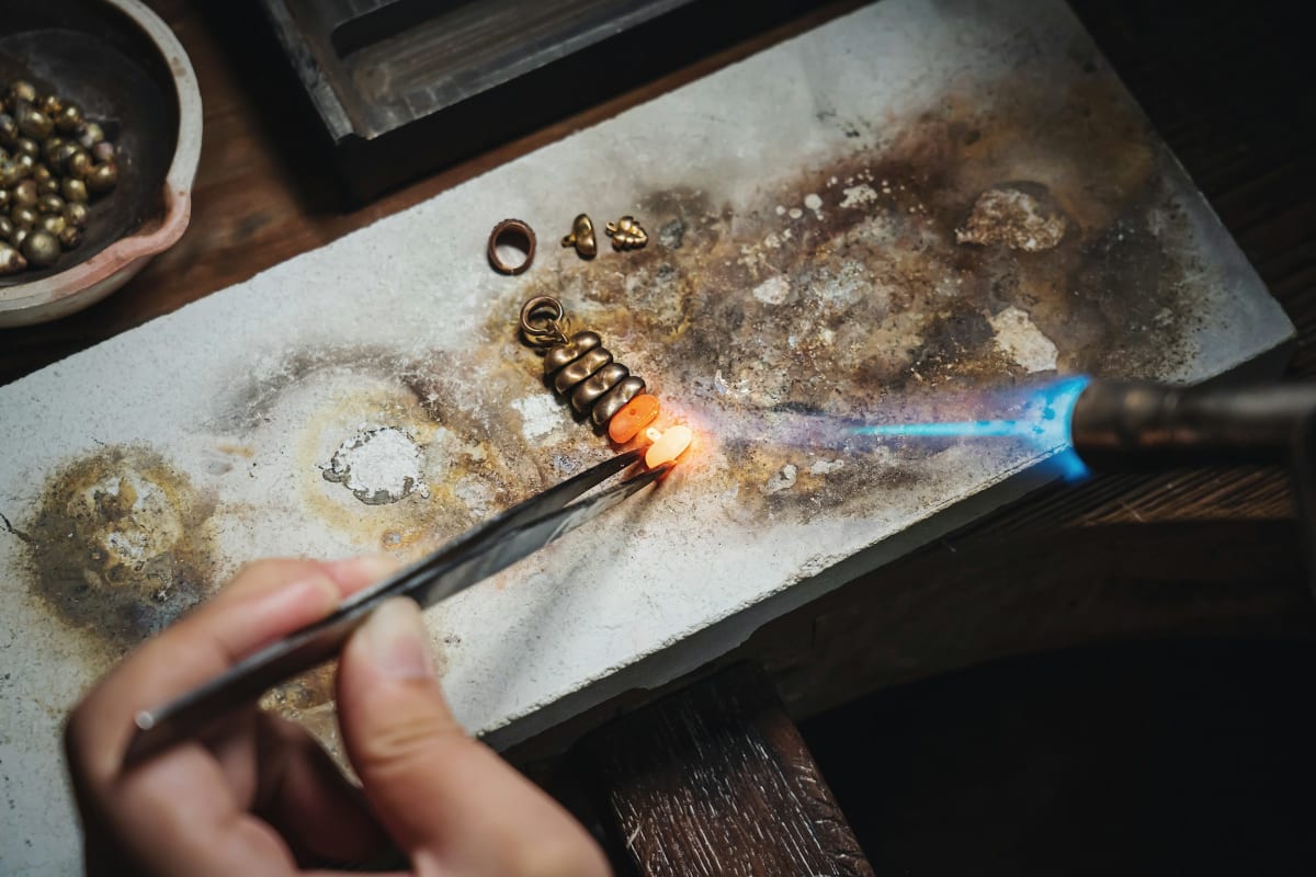 Fine torch flame at work on a small metal part