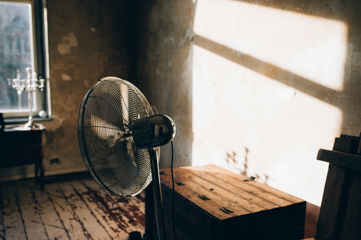 Metal fan in a sunlit room