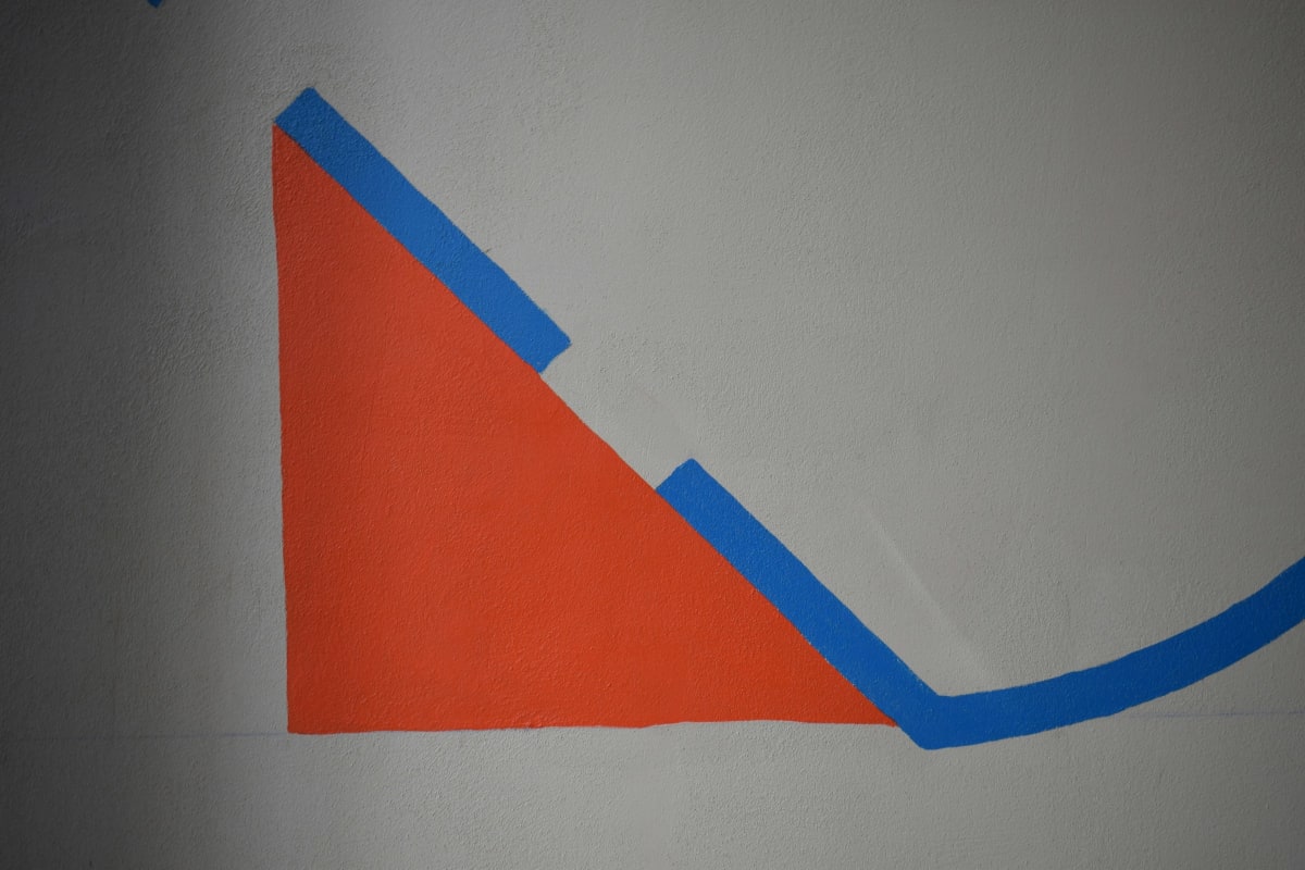 Clean painted edge along a strip of blue painters tape