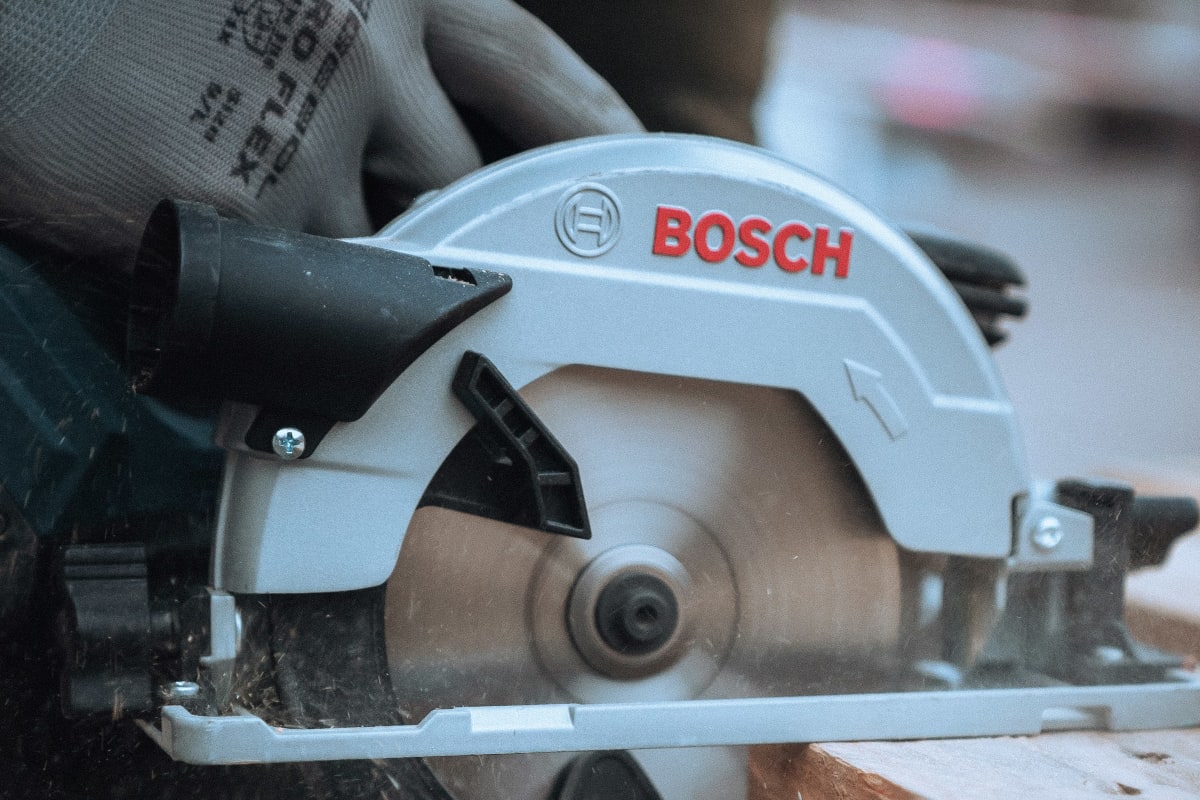 Circular saw cutting through lumber