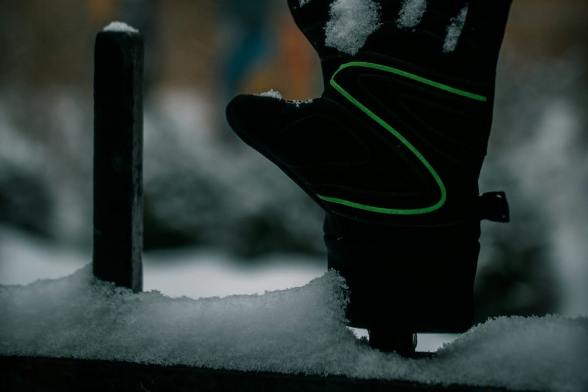 Insulated work glove dusted with snow