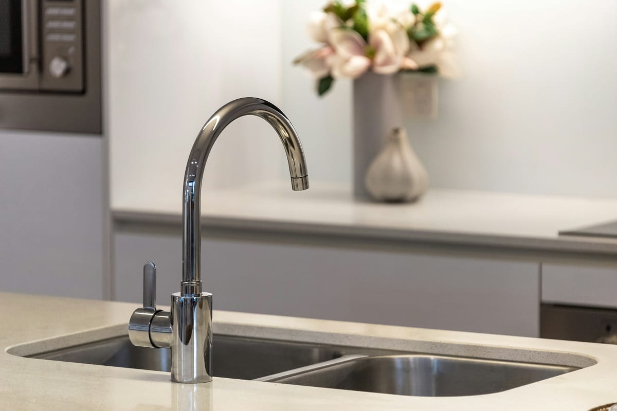 Kitchen faucet over a stainless sink