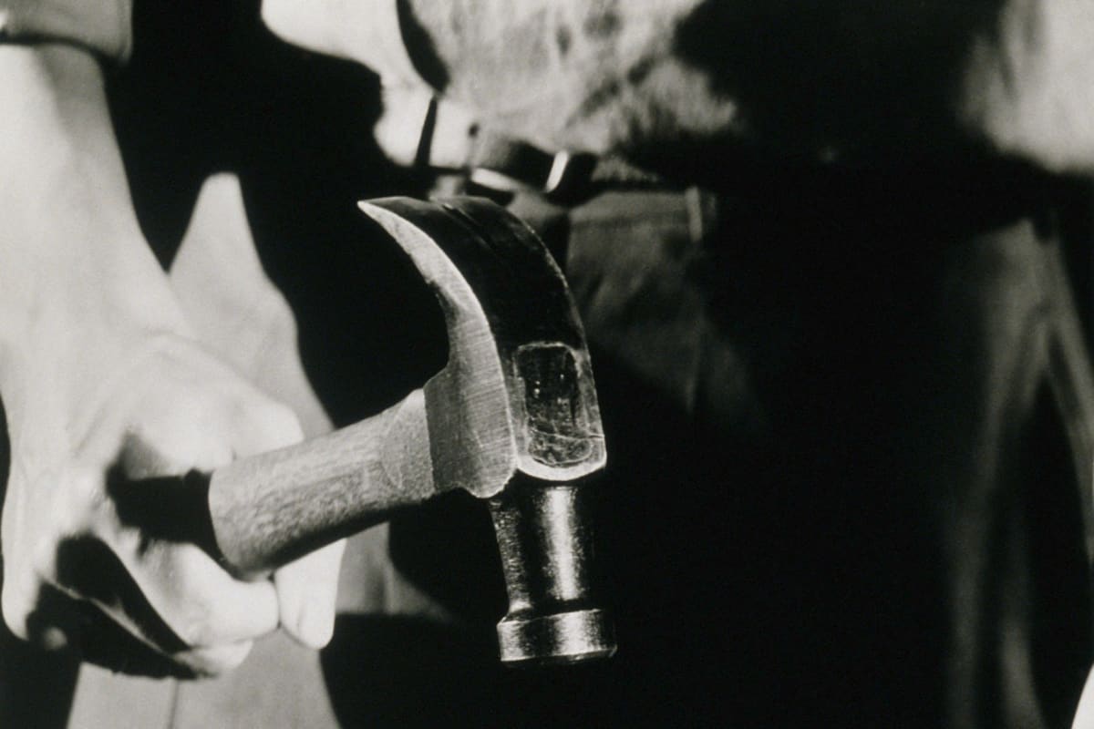 Driving a nail with a hammer