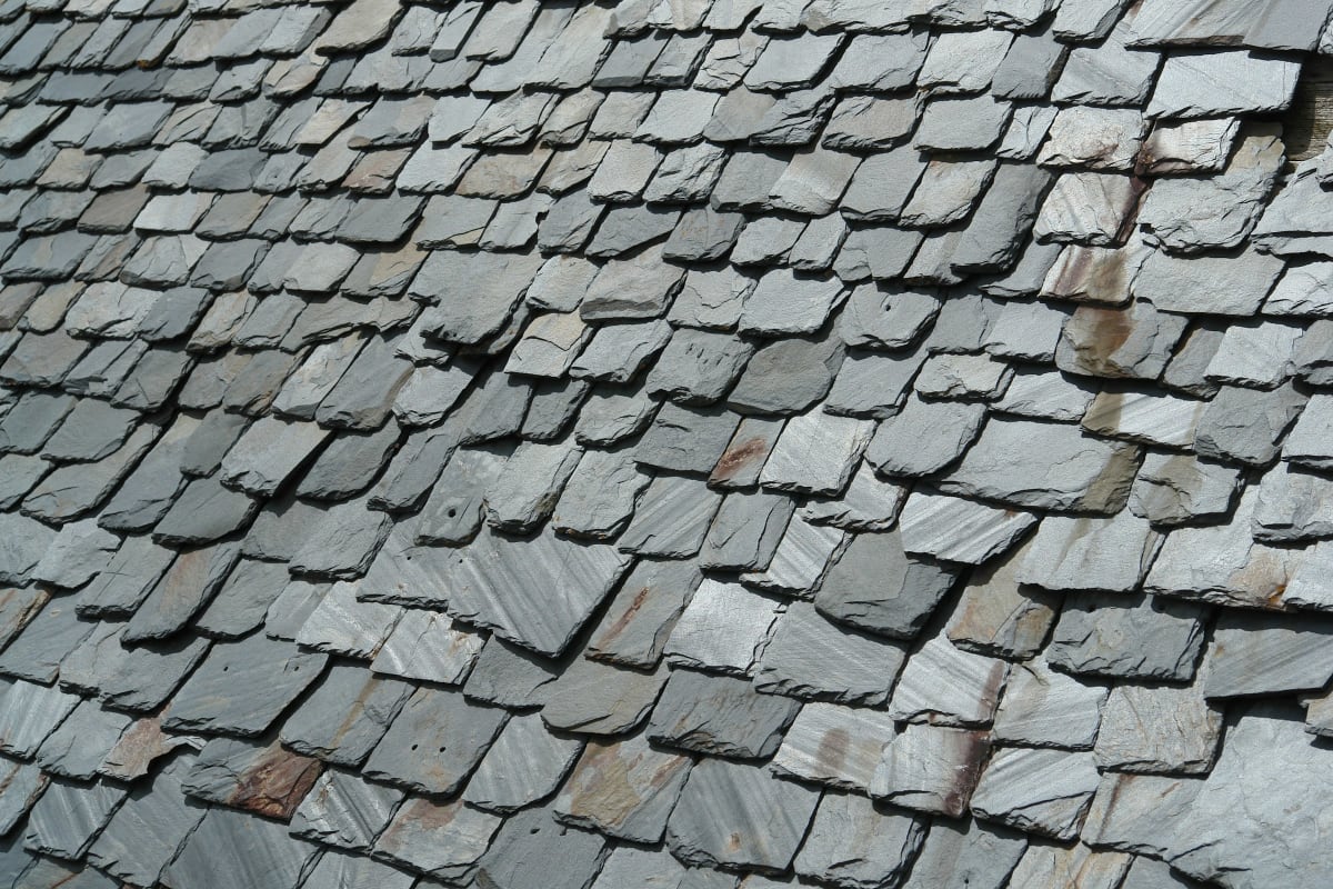 Close-up of overlapping slate roof tiles
