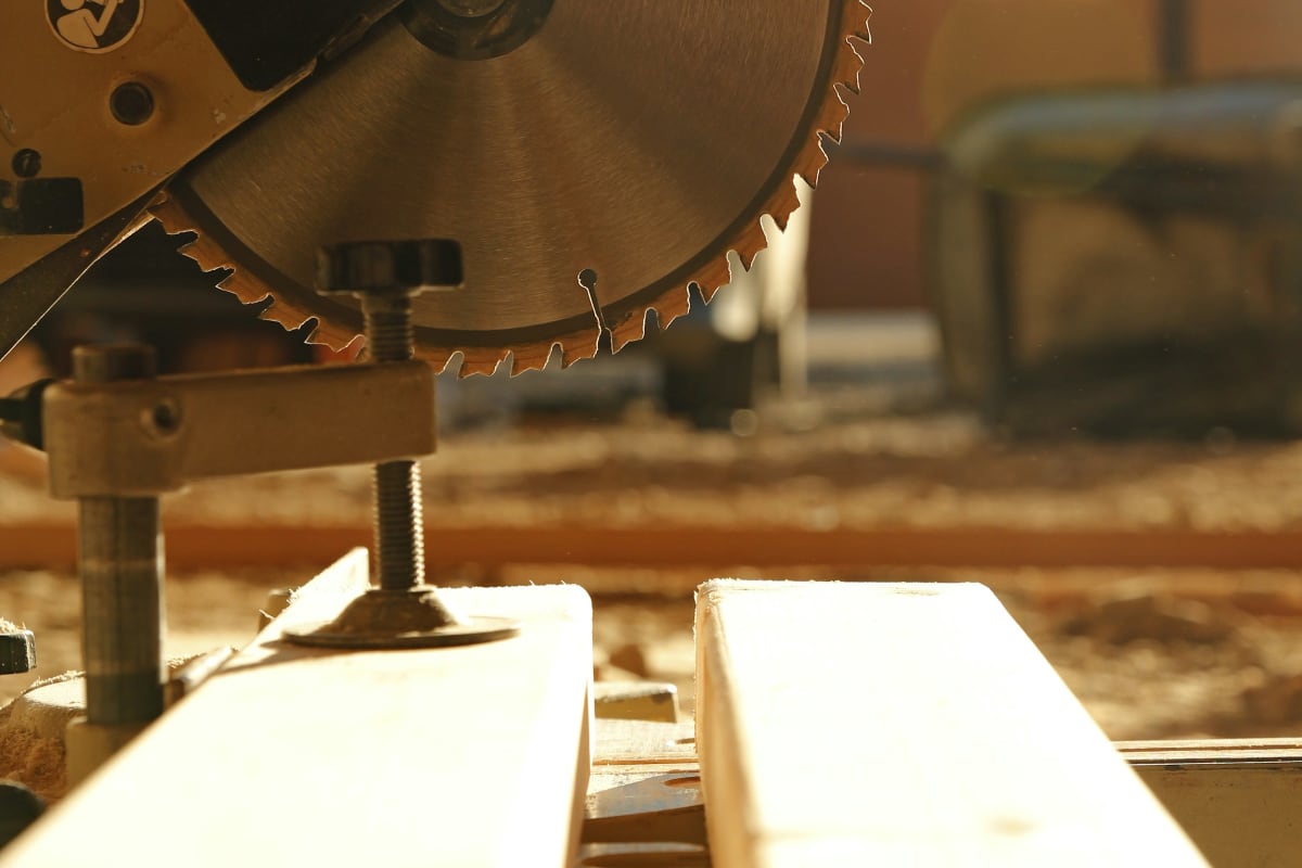 Miter saw blade over a job site