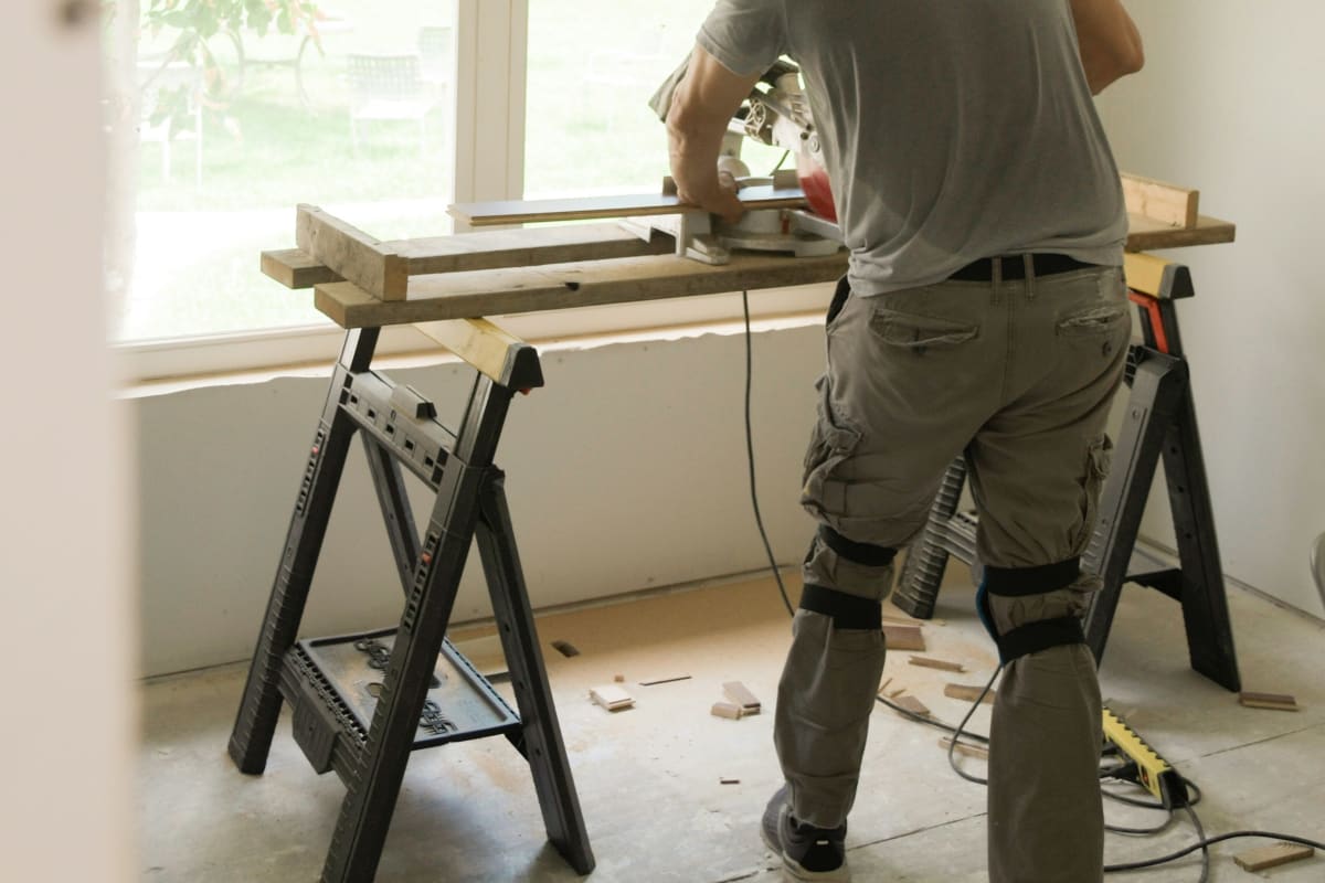 Building a project at a work table by the window