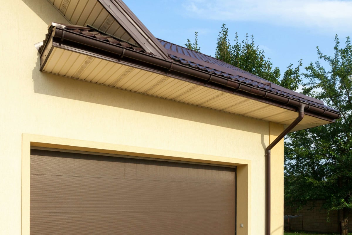 Brown garage door on a stucco home