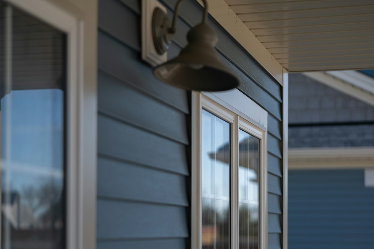 Blue lap siding around windows on a new home