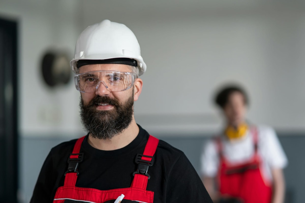 Worker in a hard hat and safety glasses