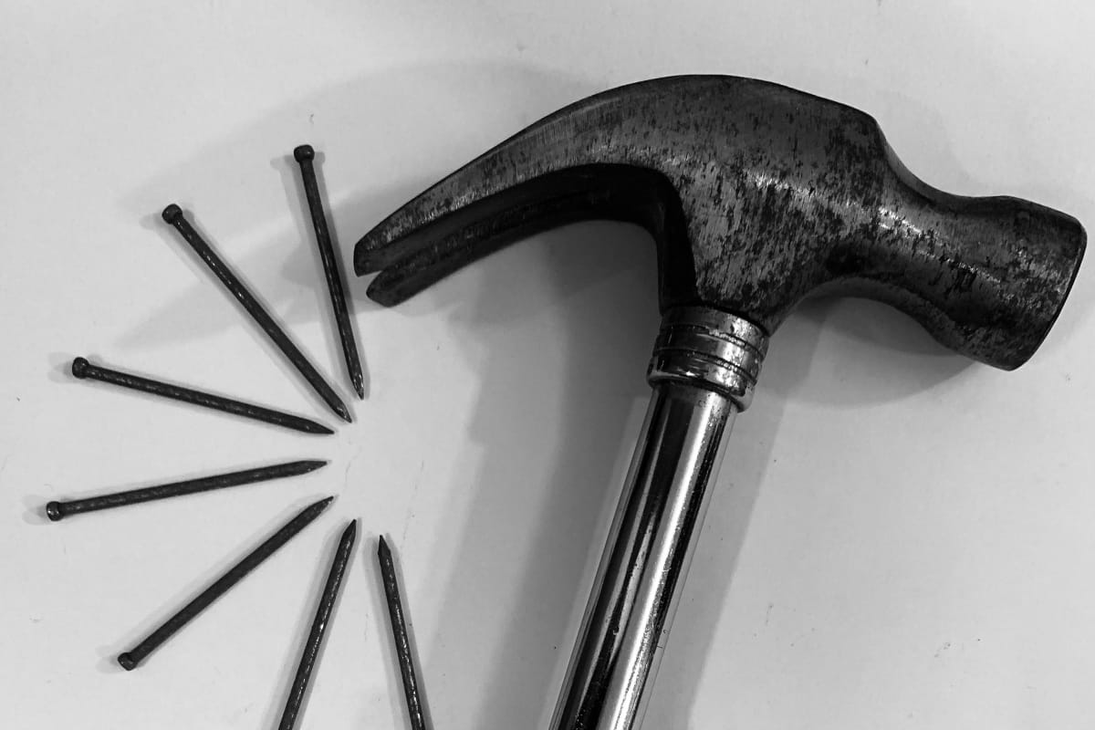 Steel hammer with nails