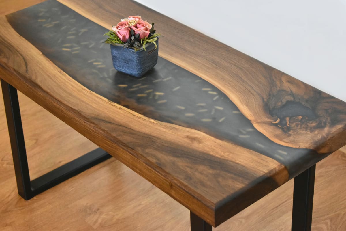 Walnut table with a glossy resin river