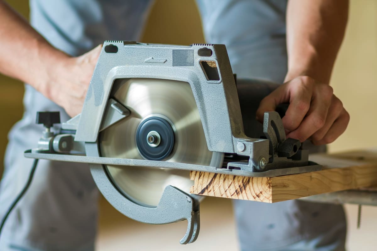 Circular saw cutting lumber