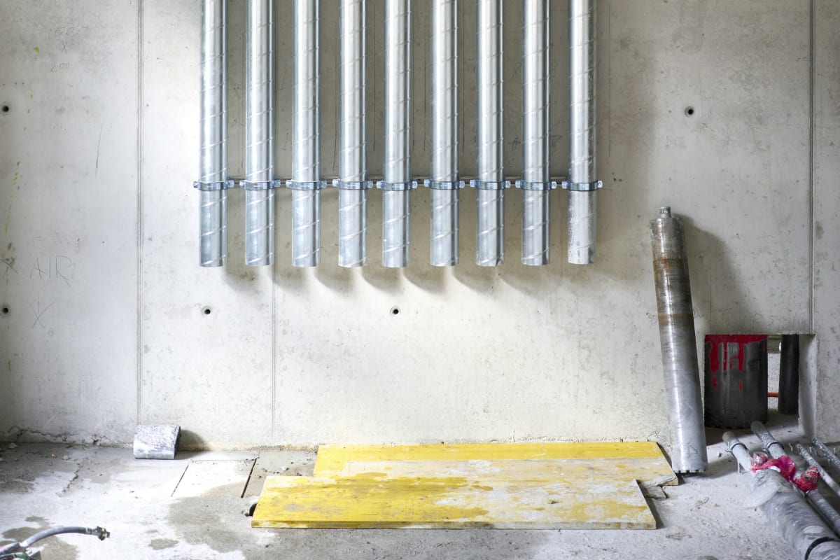 Rows of conduit strapped to a wall