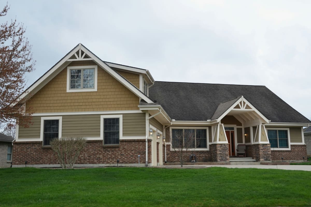Craftsman home with lap siding and stone trim