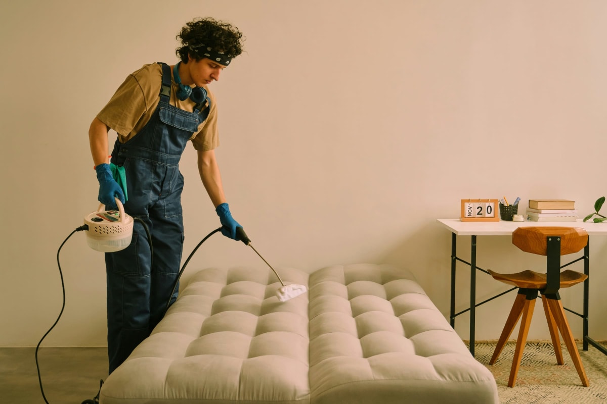 Treating a mattress with a pump sprayer