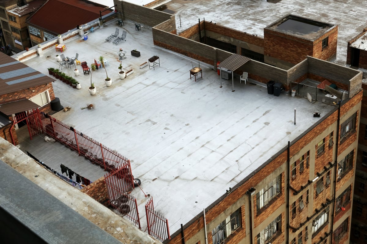 Aerial view of a white-coated flat roof