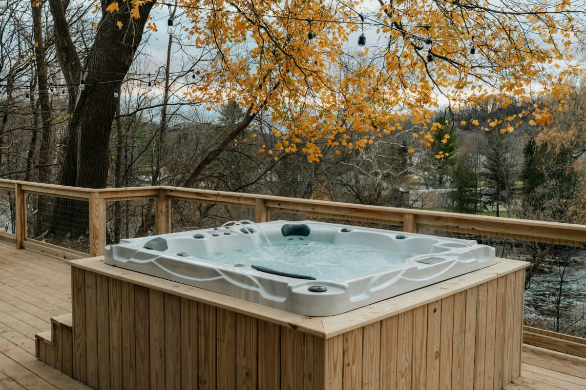 Hot tub on a wood deck in the fall