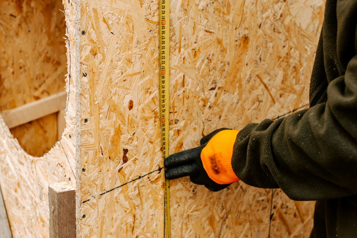 Marking a cut line on a sheathing panel