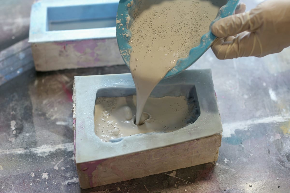 Pouring a mixed compound into a mold