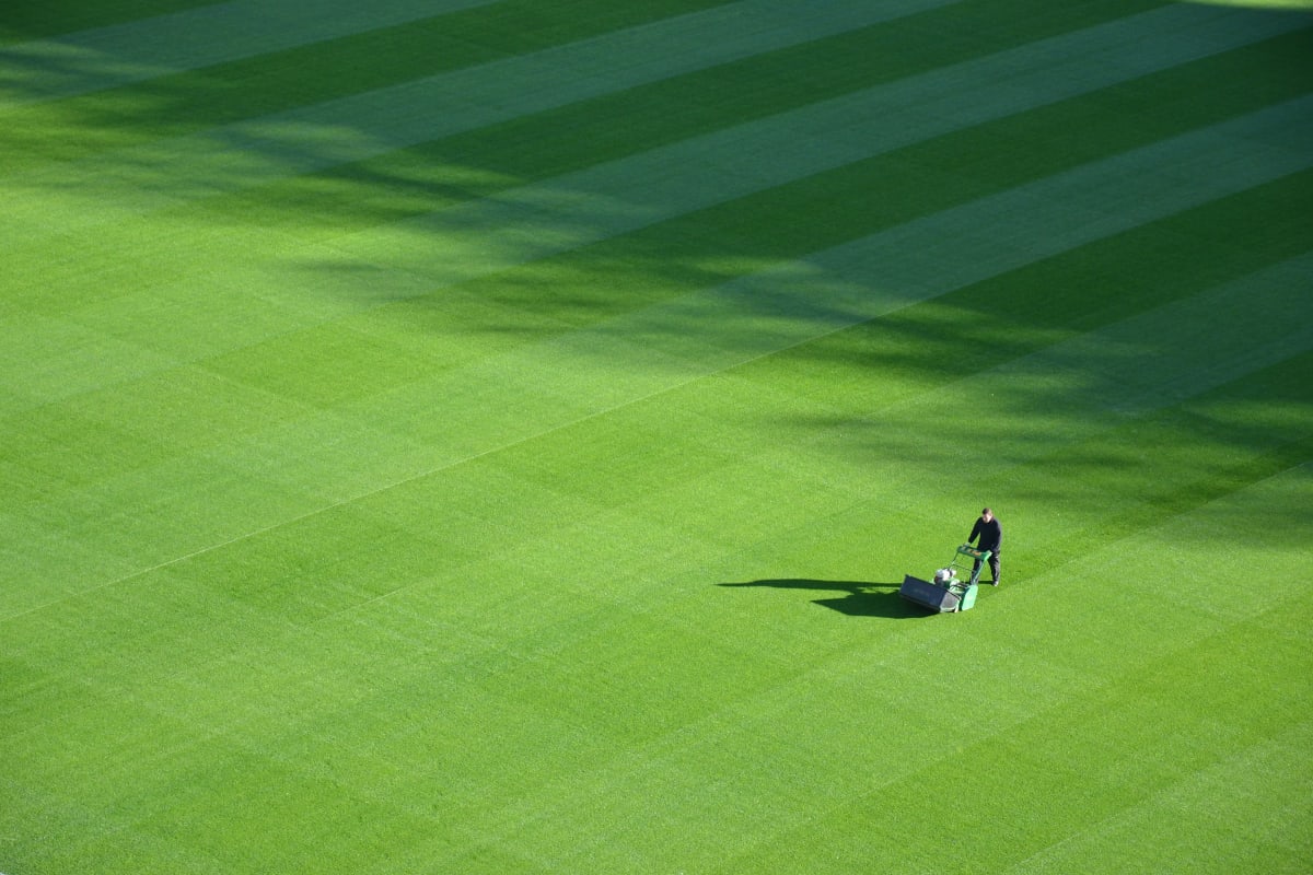 Mowing stripes into a big green lawn