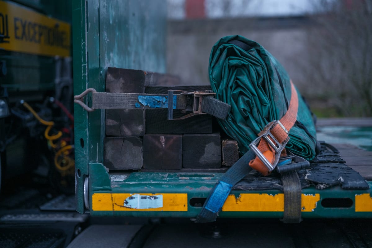 Load strapped down on a flatbed with ratchet straps
