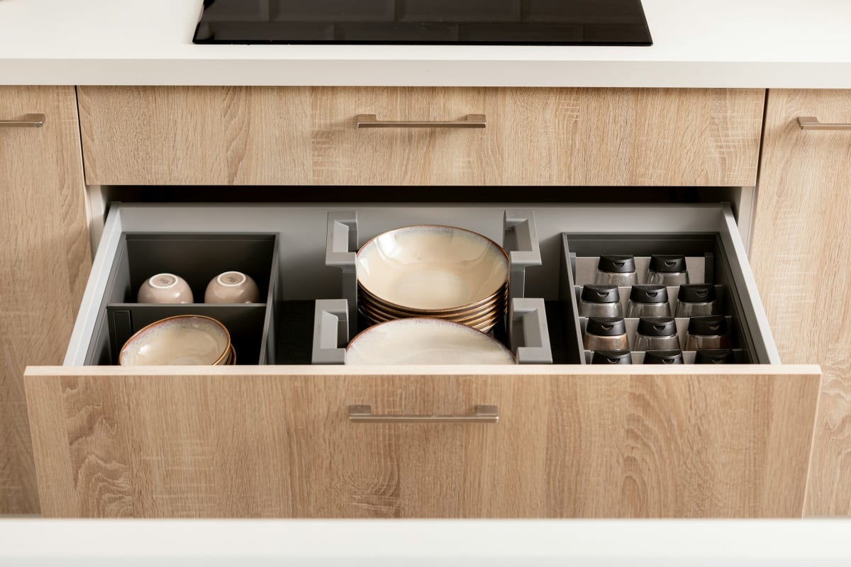 Deep pull-out drawer of dishes