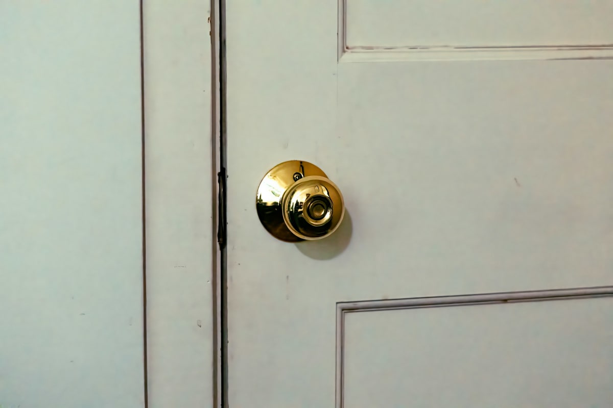 Brass knob on a painted door
